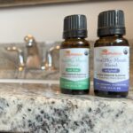 Two bottles of HealThy Mouth Blend on the sink